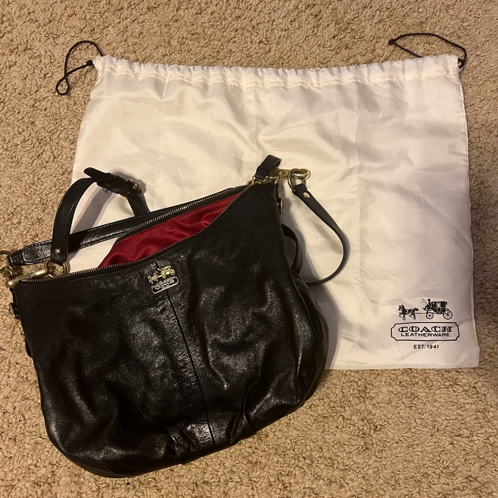 Black leather Coach purse, gold detail.